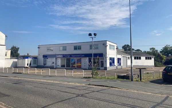 Site of former car showroom with permission for 55 apartments up for sale